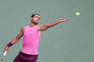 Carlos Alcaraz prepares to serve against Jannik Sinner at US Open | Image Source: Getty